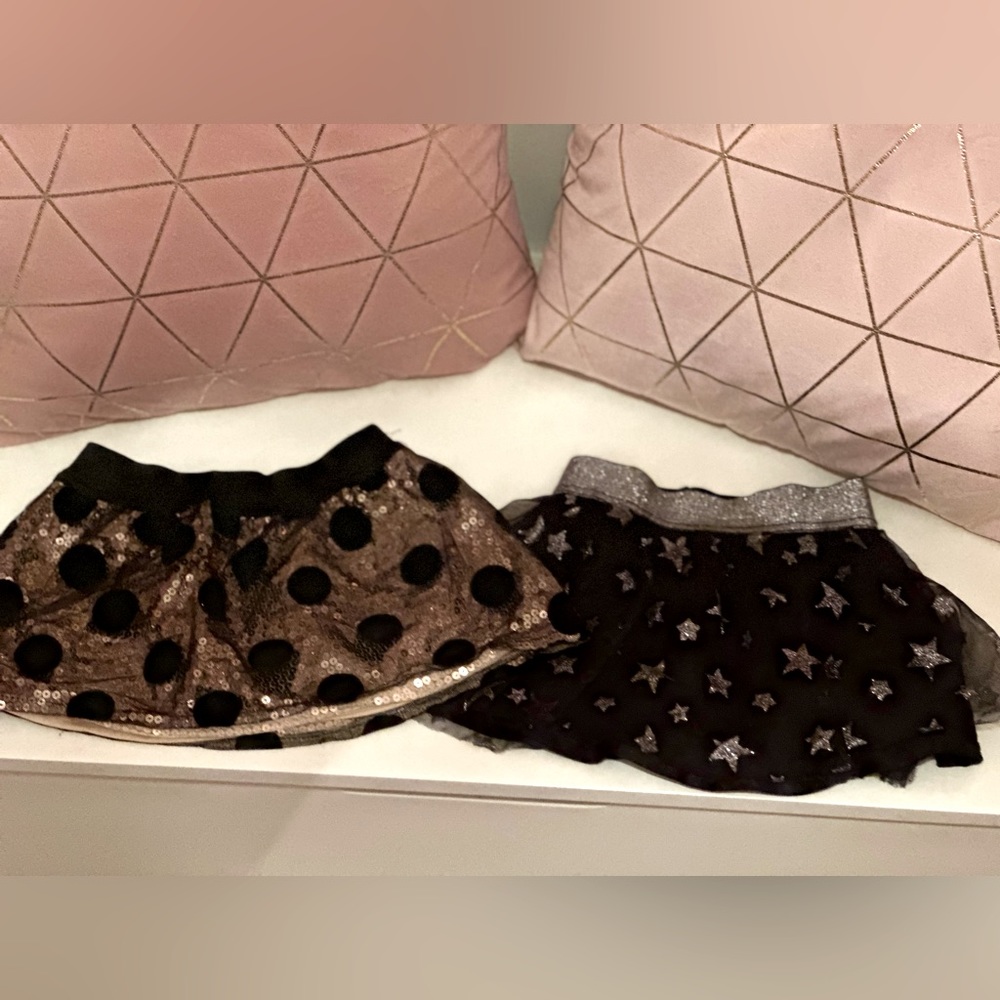 Skirts. Gold sparkle polka dot tutu 2T.  Black & silver star tutu is size 24m